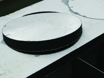 Composite material cutting